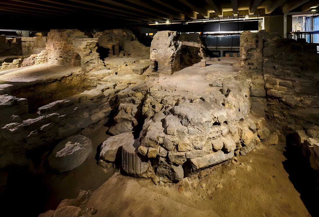Notre Dame Crypt interior with ancient stone arches and historical artifacts in Paris, France