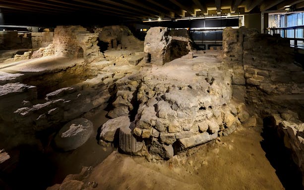 Notre Dame Crypt interior showcasing ancient stone ruins and archaeological remains.
