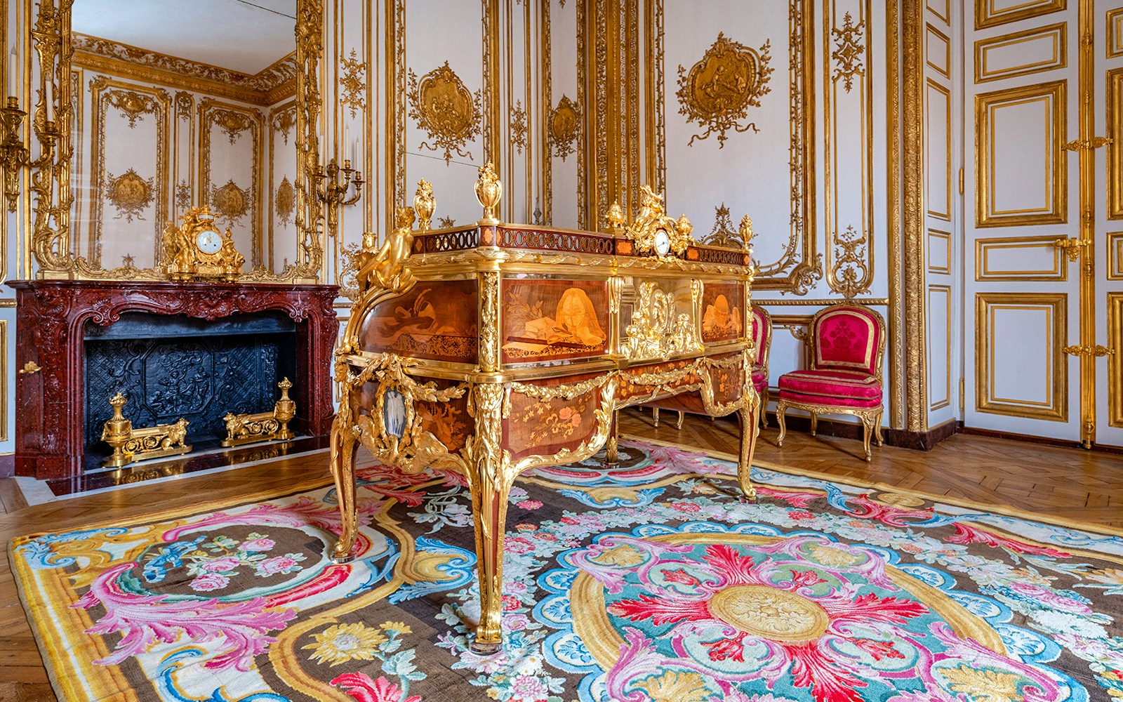 King’s Private Apartments in Versailles Palace with ornate desk and gilded decor.