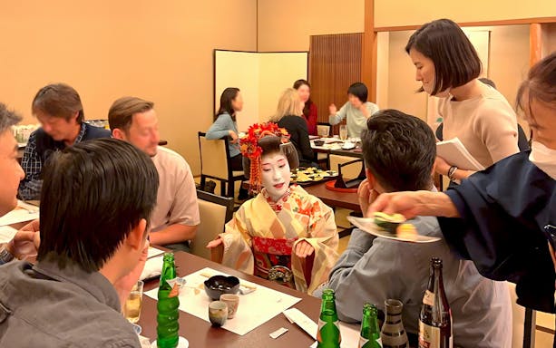 Geisha performing at a Kaiseki dinner in Japan.