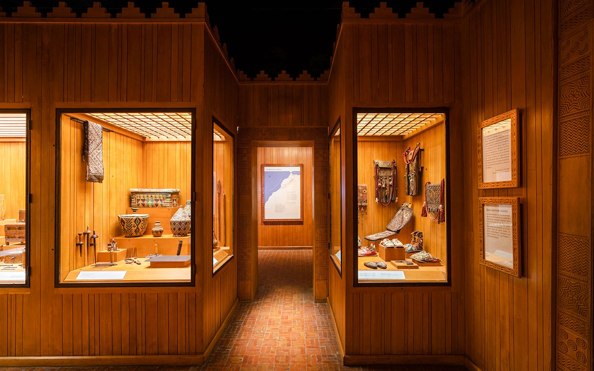 Berber artifacts displayed in wooden showcases at the Berber Museum, Marrakech.