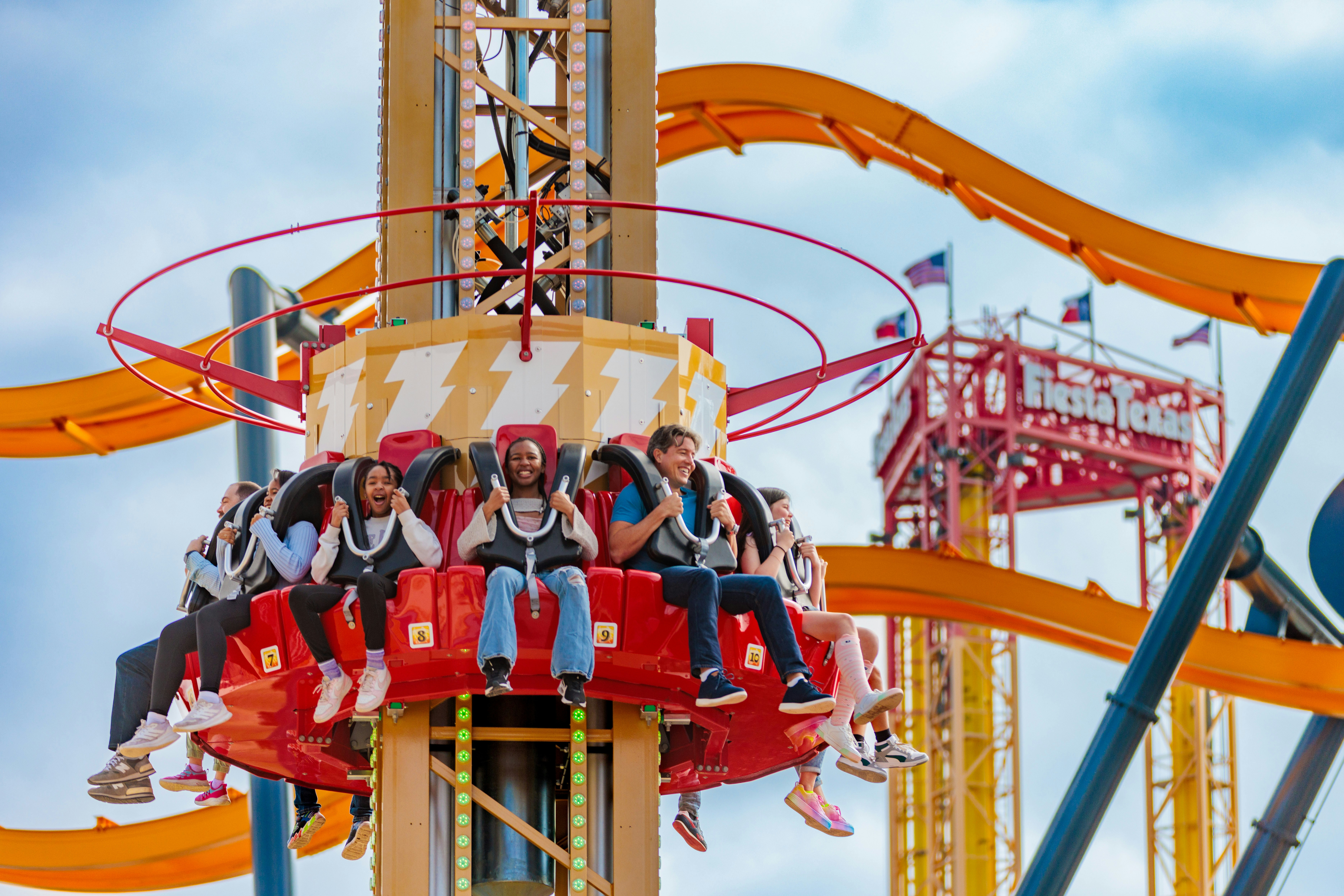 Riders enjoying SHAZAM™ Tower of Eternity at Six Flags Fiesta Texas.
