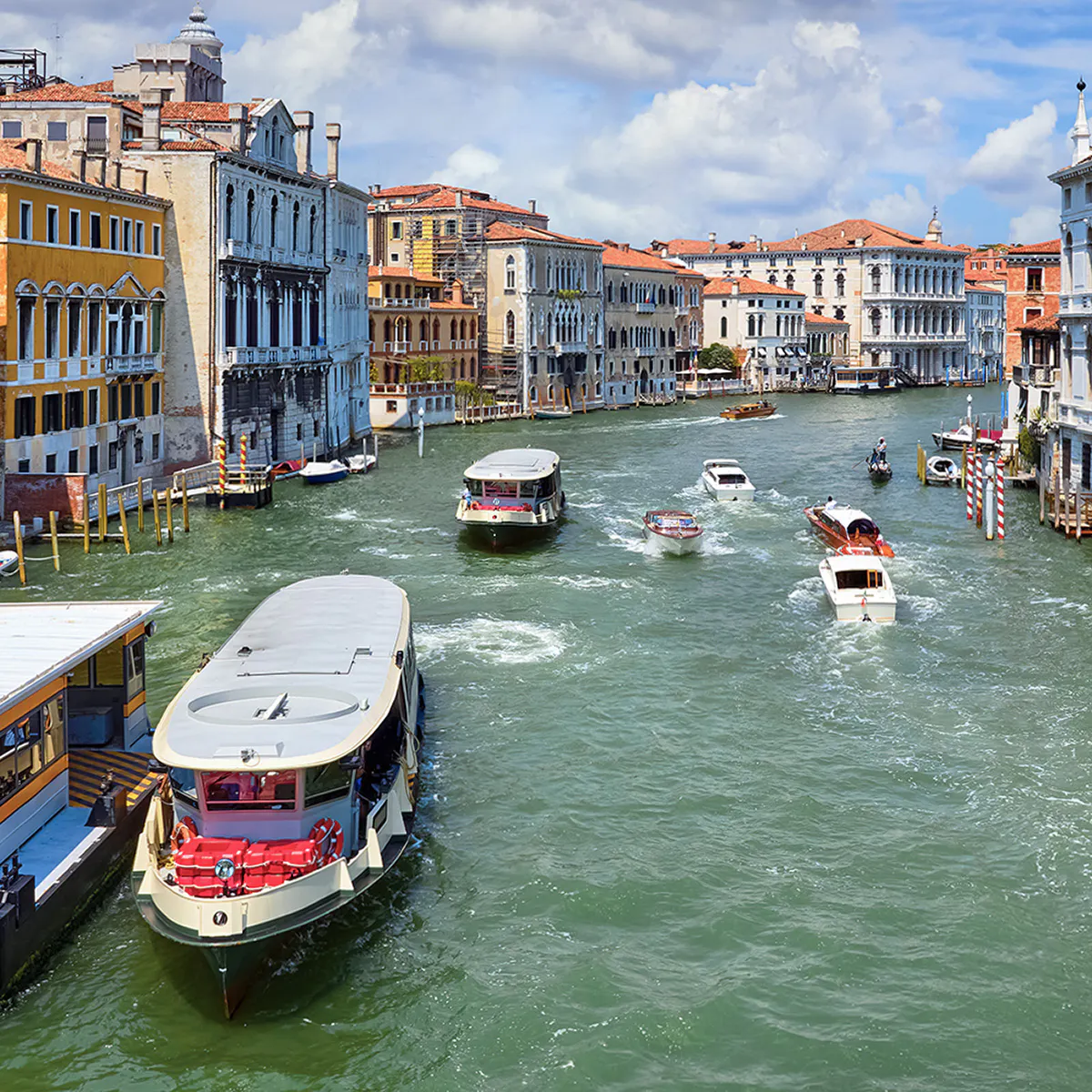 Vaporetto on Grand Canal, Venice, Italy with historic buildings in view.