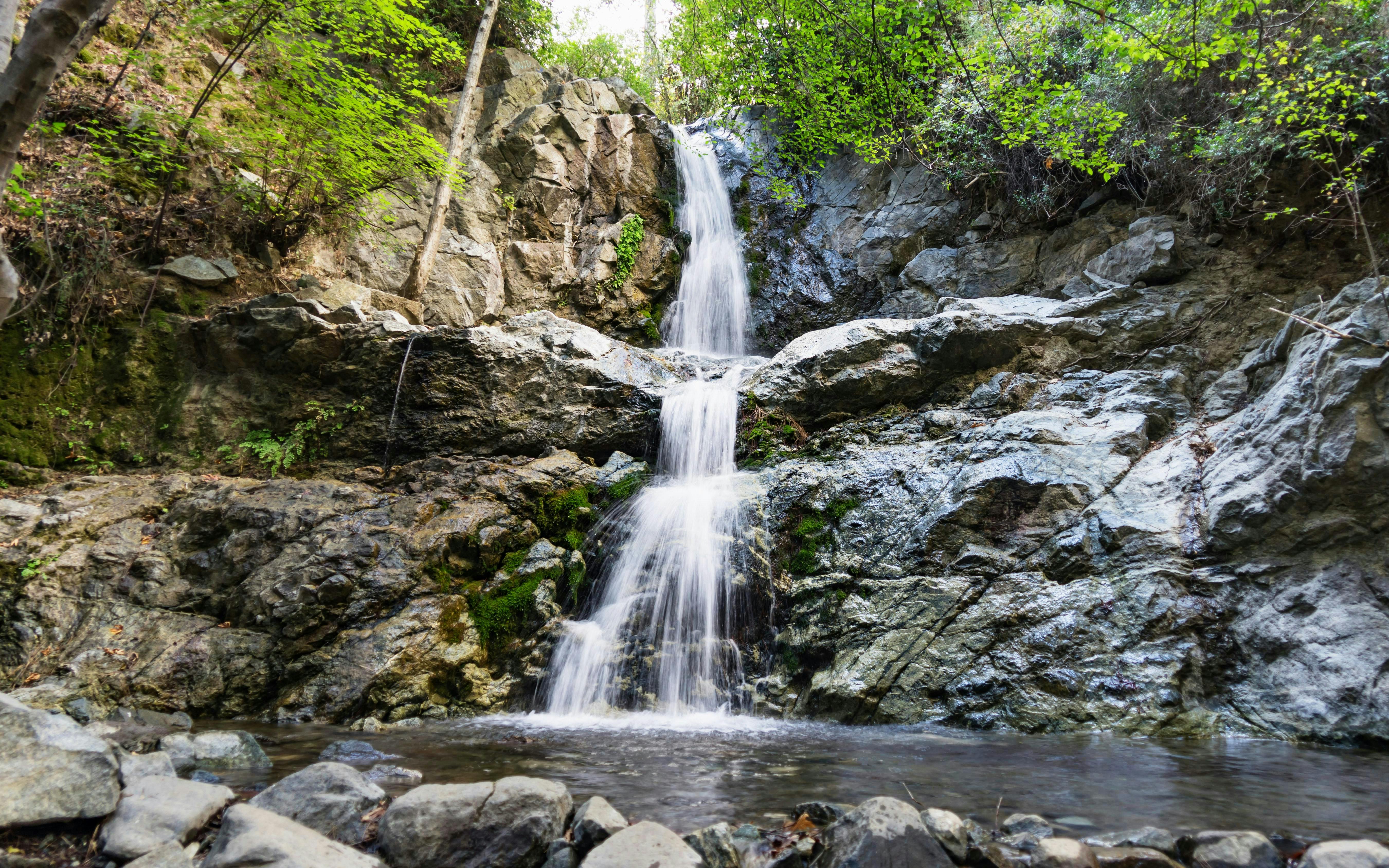 Waterfall cascading over rocks in Troodos Mountains, Cyprus forest.