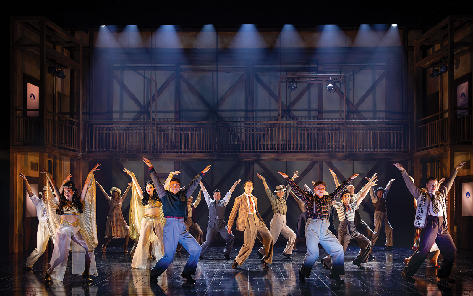 Performers dancing on stage in a theatrical production on Sunset Boulevard.