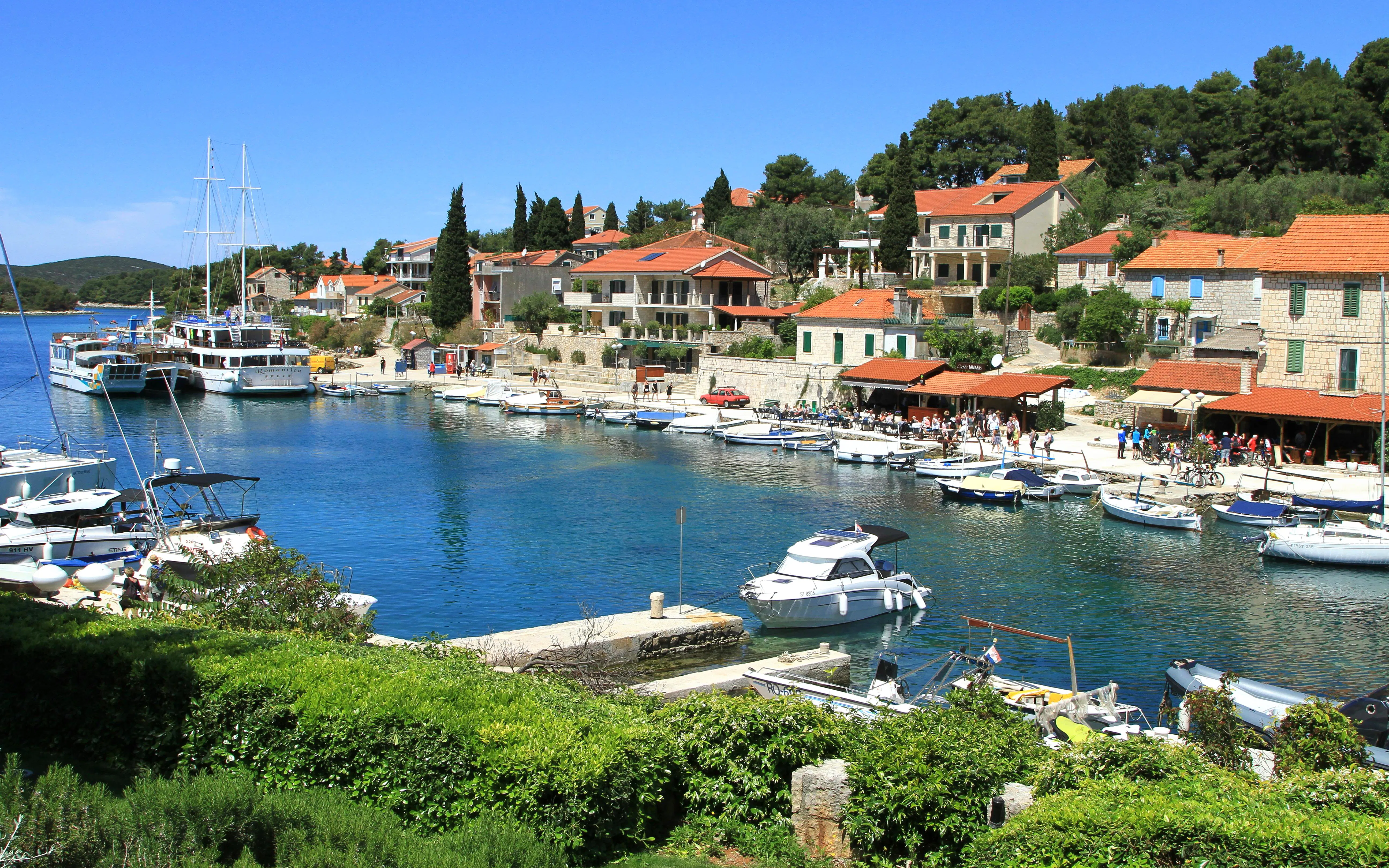 Maslinica marina with boats and waterfront buildings, Croatia.