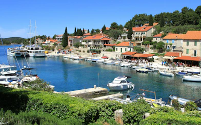 Maslinica marina with boats and waterfront buildings, Croatia.