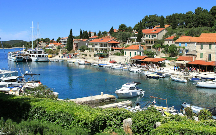 Maslinica marina with boats and waterfront buildings, Croatia.