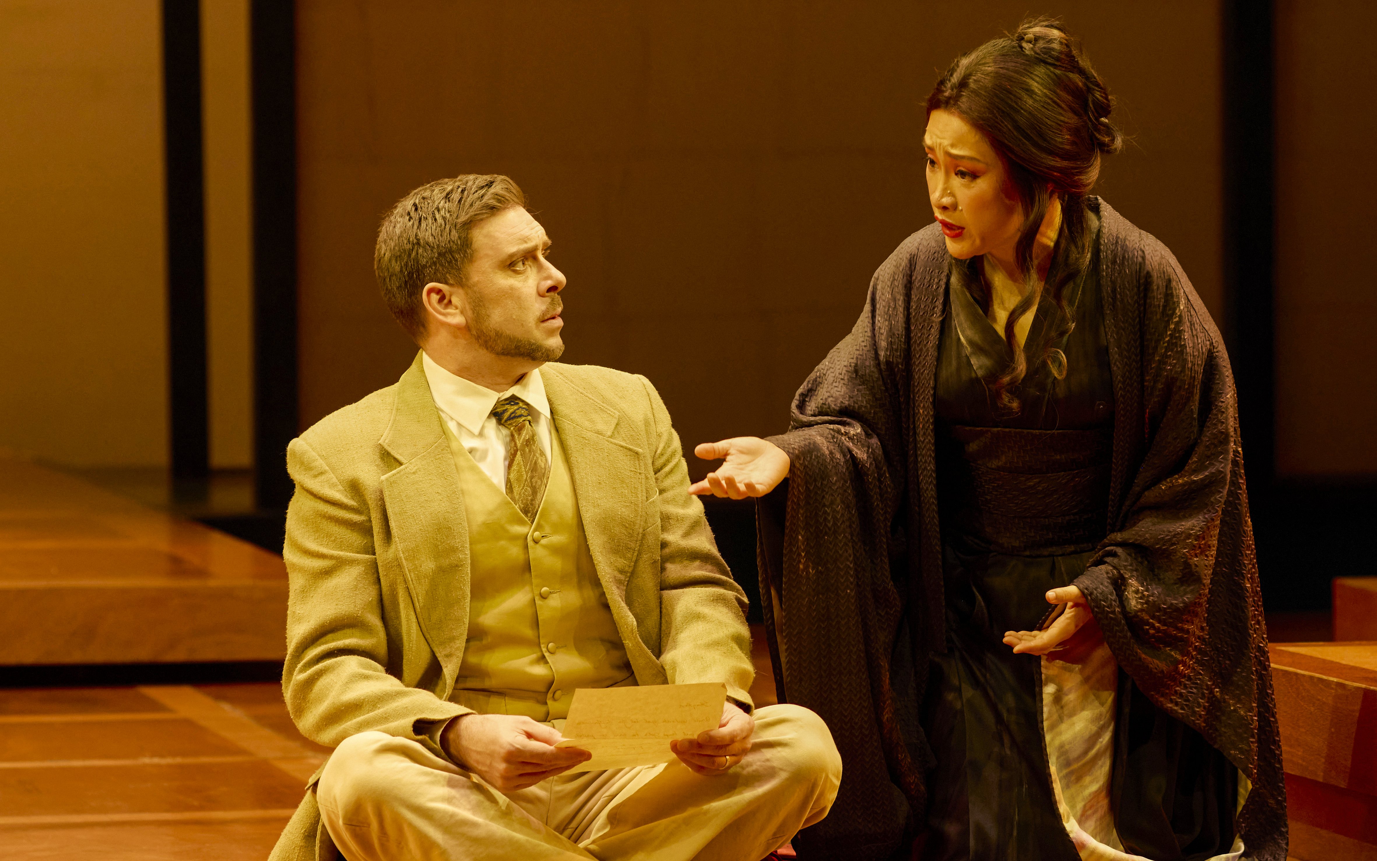 Stage scene from Madama Butterfly in Sydney with two performers in conversation.