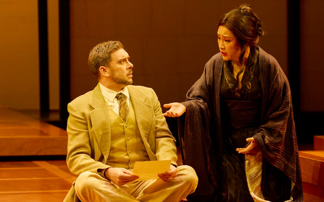 Stage scene from Madama Butterfly in Sydney with two performers in conversation.