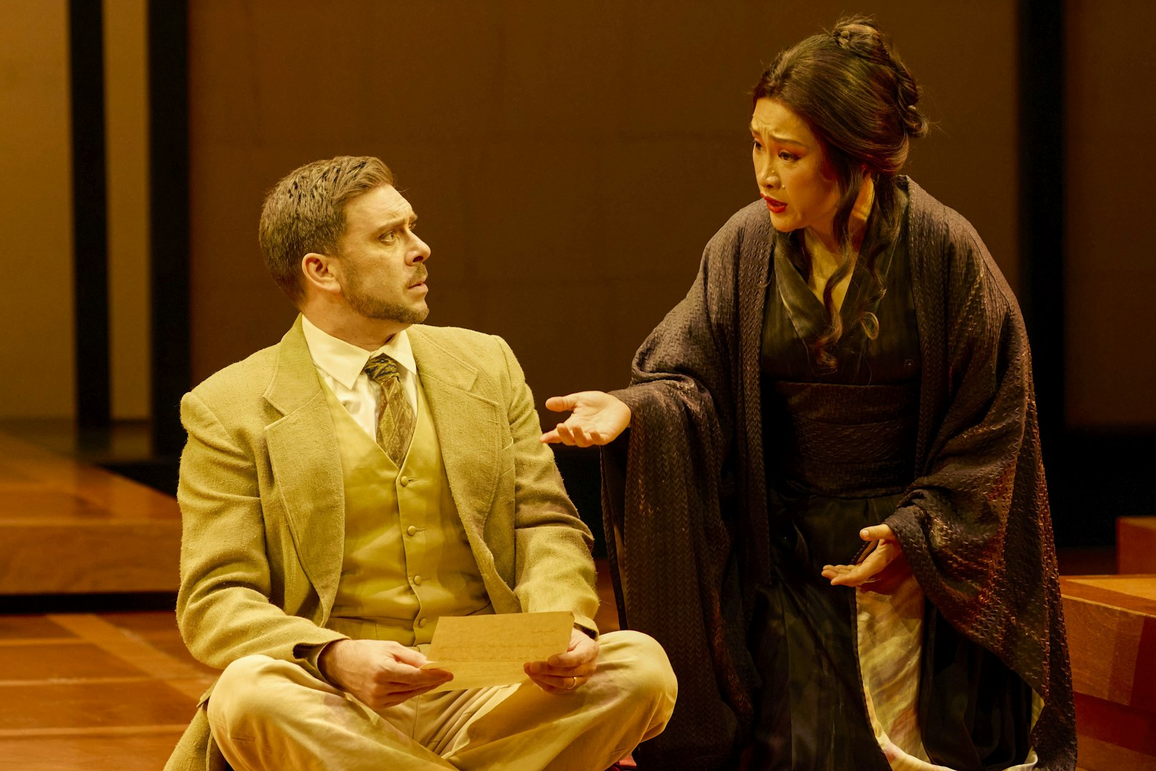 Stage scene from Madama Butterfly in Sydney with two performers in conversation.