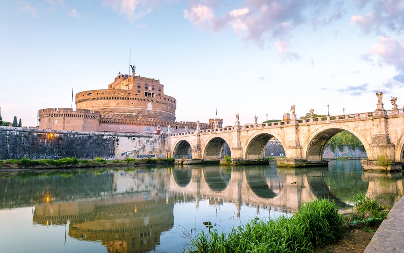 Castel Sant'Angelo and Ponte Sant'Angelo at sunset in Rome.