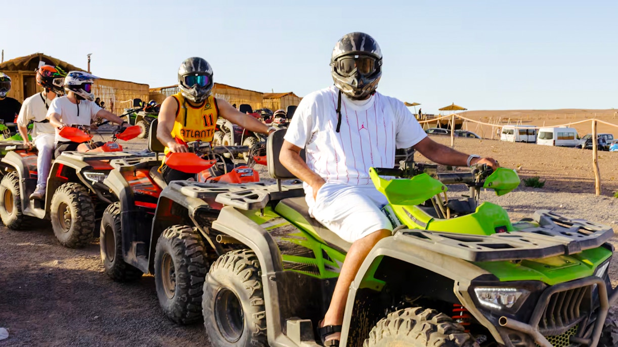 People riding quad bikes in Agafay Desert, Marrakesh.