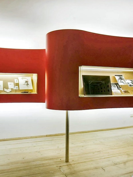 Exhibit display in Salzburg museum showcasing historical documents and artifacts.