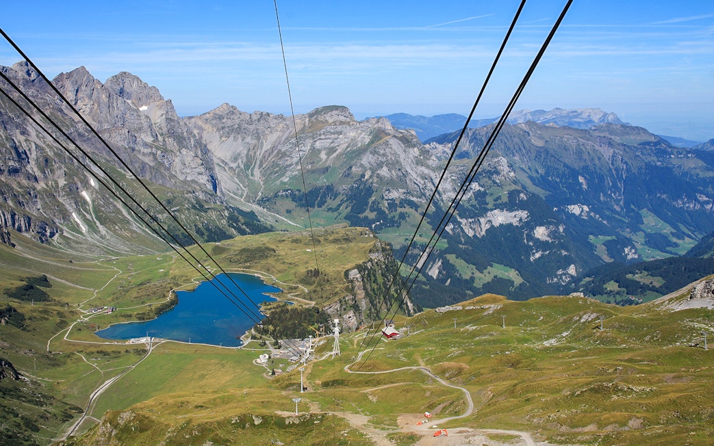 Titlis cable car summit view with mountains and lake in Switzerland.
