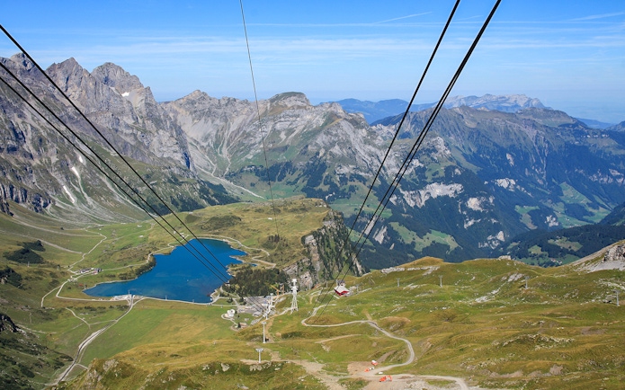 Titlis cable car summit view with mountains and lake in Switzerland.