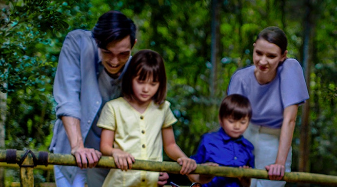 Family observing wallabies at Singapore Night Safari.