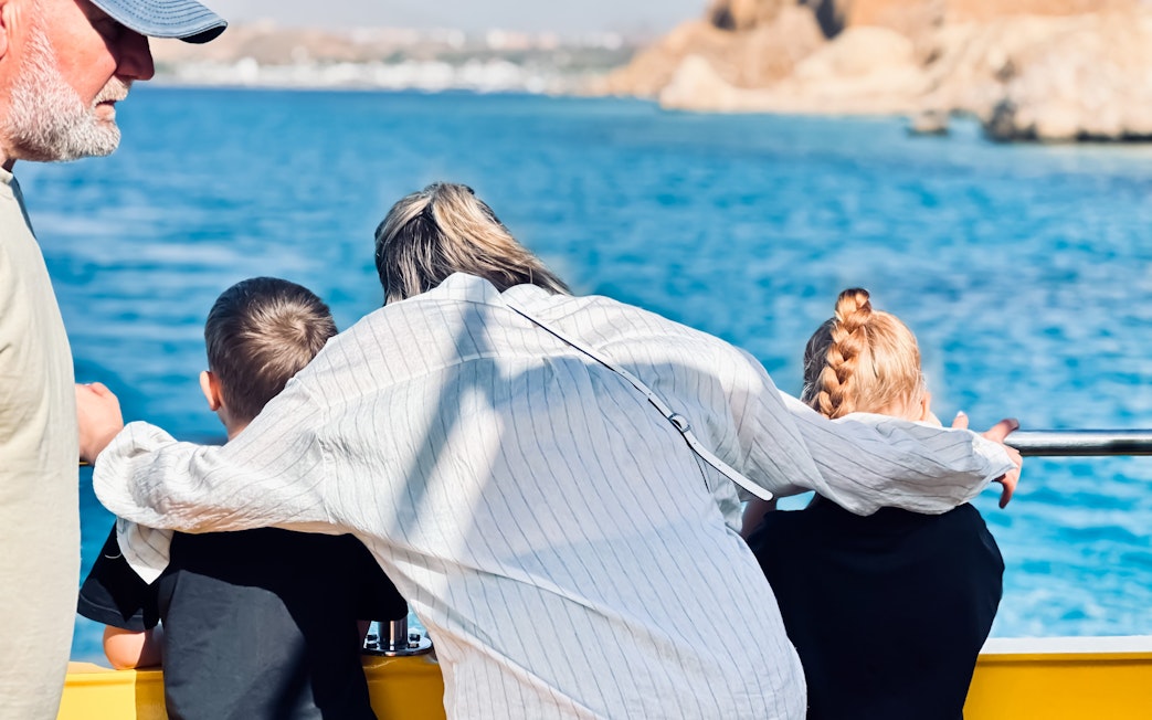 Family enjoying ocean view from Royal Seascope Submarine, Hurghada.