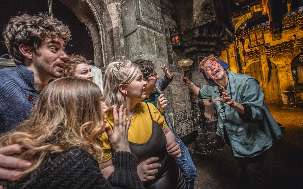 Group reacting to actor portraying the Foul Clenger at Mary King's Close, Edinburgh.