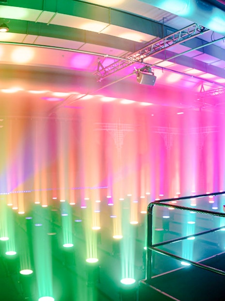 Guest interacting with light display at Amaze Amsterdam.