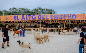 El Alto del Chocho entrance with visitors and farm animals, Antioquia, Colombia.