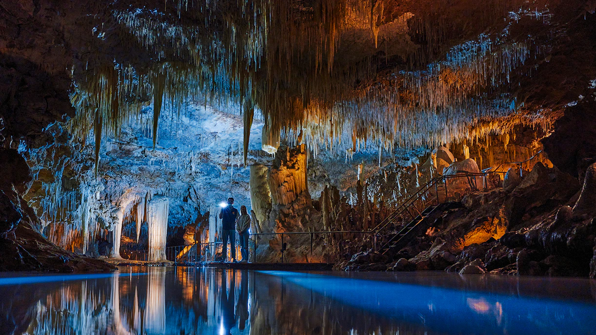 Visitors exploring stalactites in Lake Cave, Margaret River.