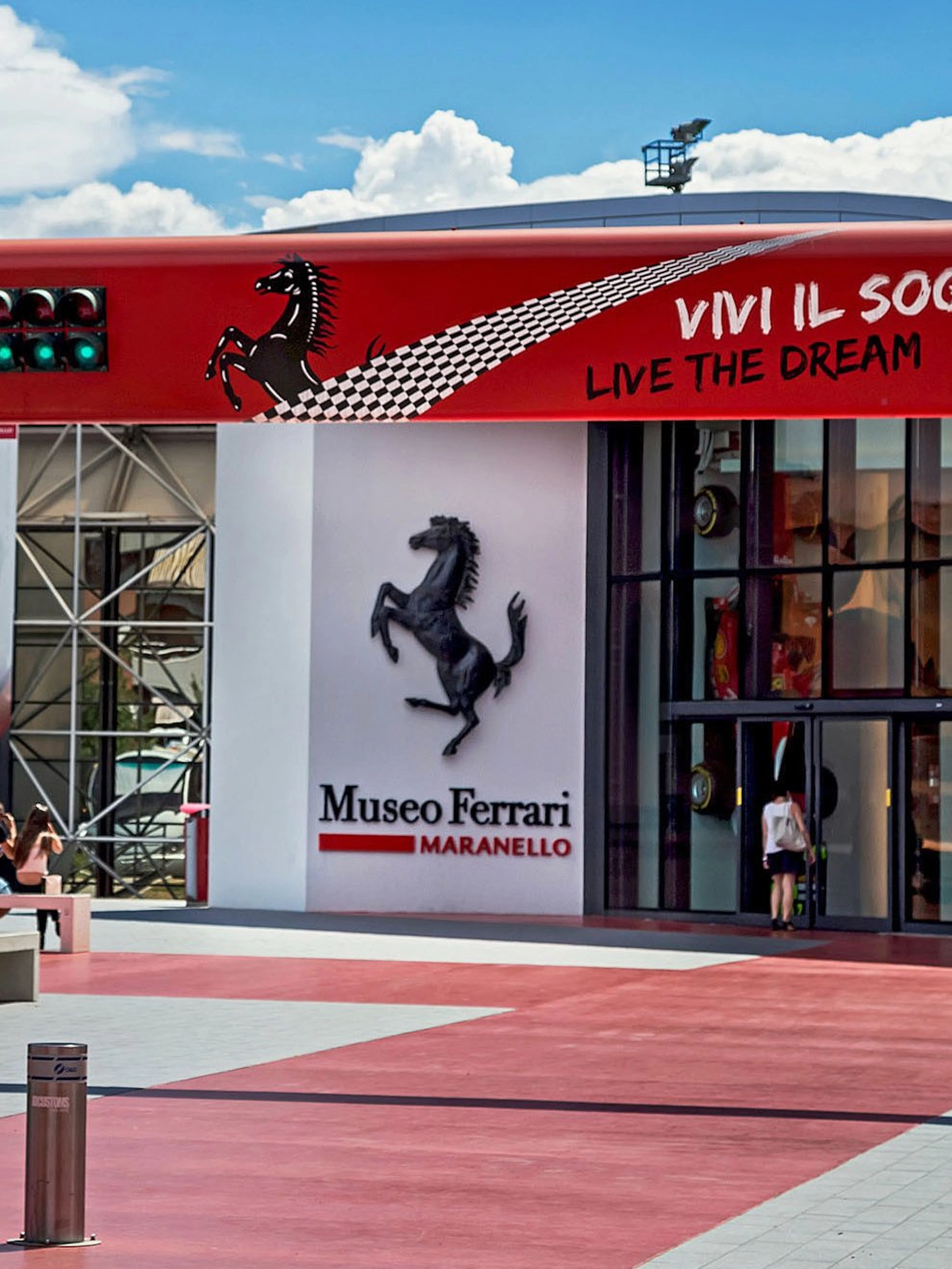 Entrance of the Ferrari Museum in Maranello with iconic prancing horse logo.