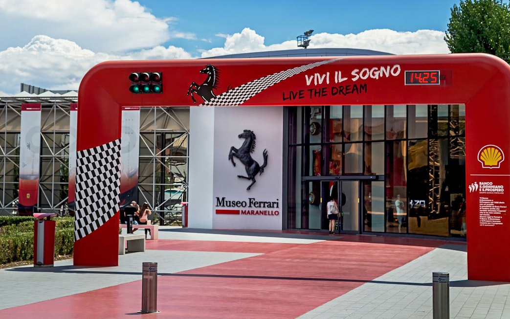 Entrance of the Ferrari Museum in Maranello with iconic prancing horse logo.