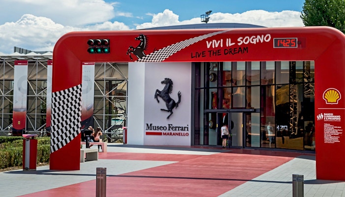 Entrance of the Ferrari Museum in Maranello with iconic prancing horse logo.