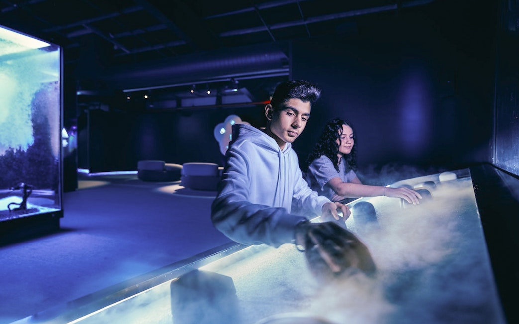 Visitors engaging with interactive exhibits at Scienceworks.