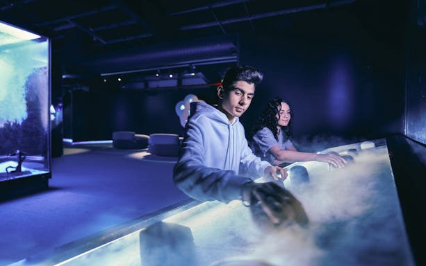Visitors engaging with interactive exhibits at Scienceworks.