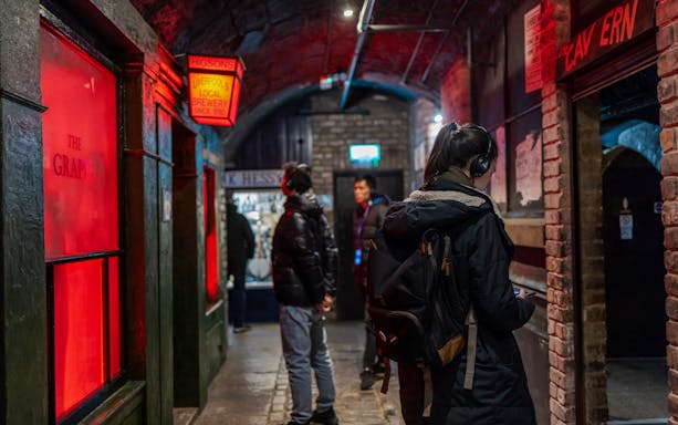 Visitors exploring The Beatles Story exhibit interiors in Liverpool.