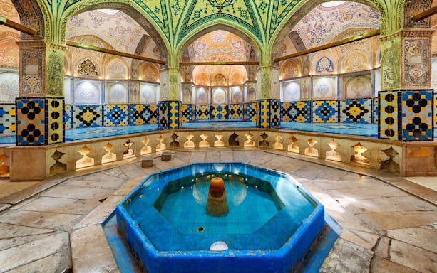 Interior of a traditional Turkish bath with intricate tilework in Istanbul.