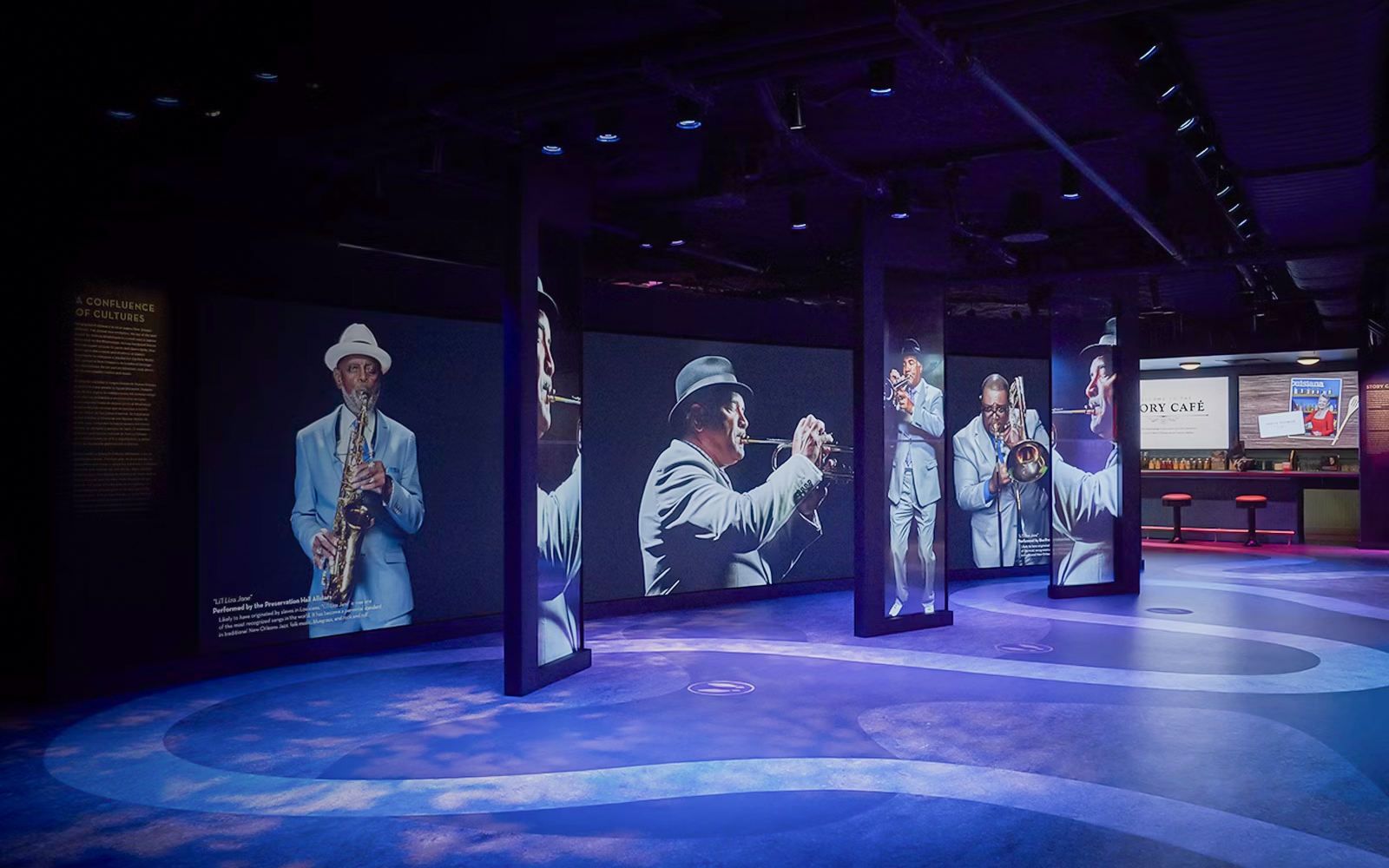 Musicians displayed on digital screens at Vue Orleans Observation Deck.