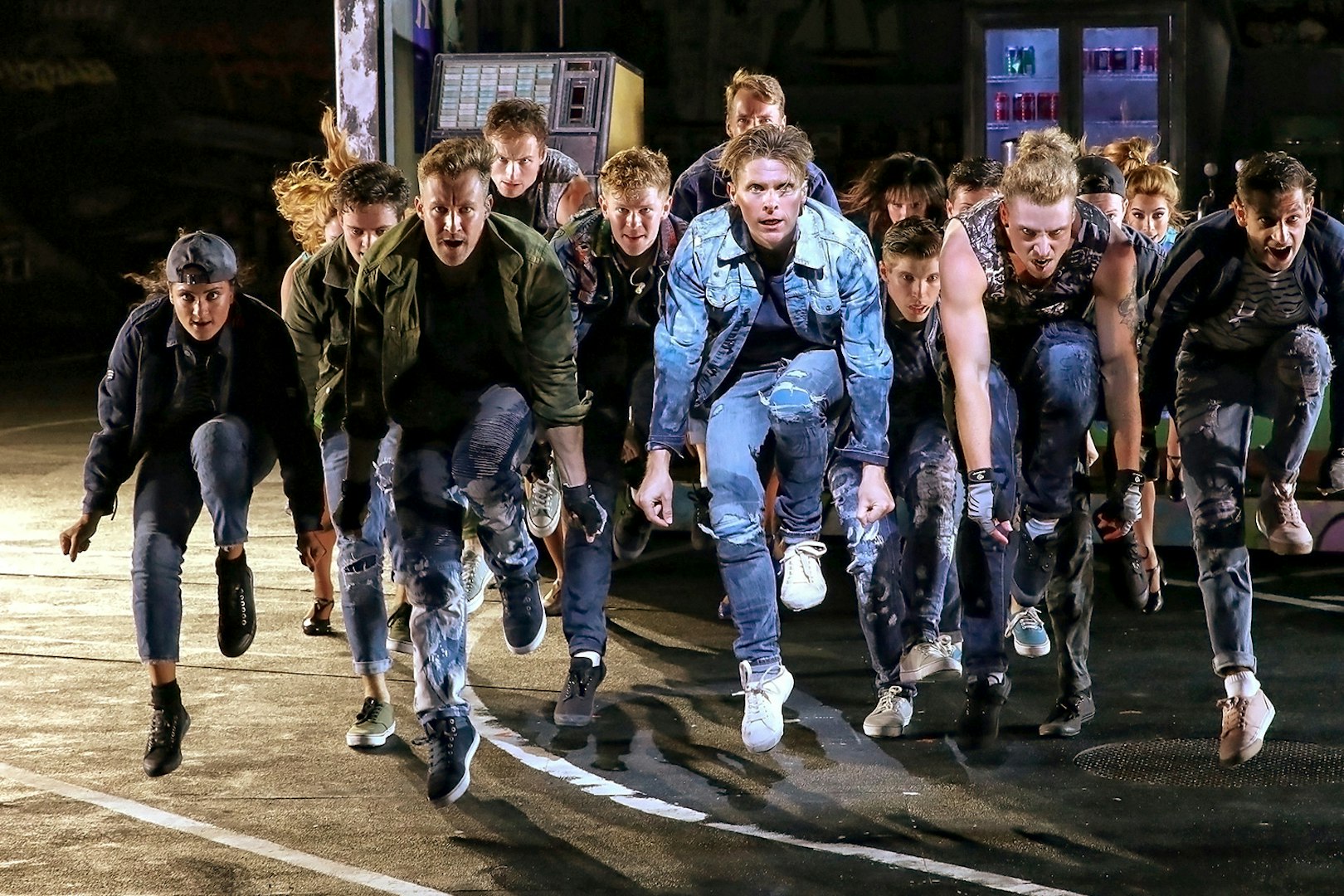 Performers in dynamic pose during West Side Story on Sydney Harbour.