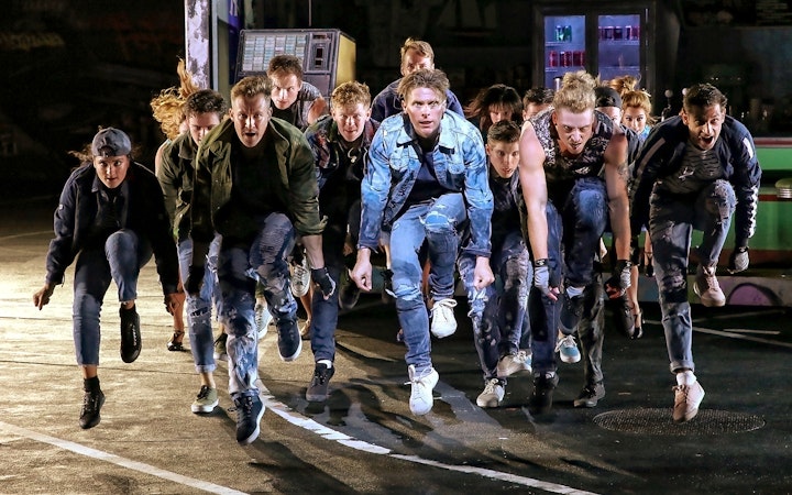 Performers in dynamic pose during West Side Story on Sydney Harbour.