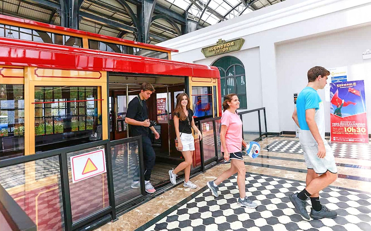 Visitors exiting cable car at Sun World Fansipan Legend station.