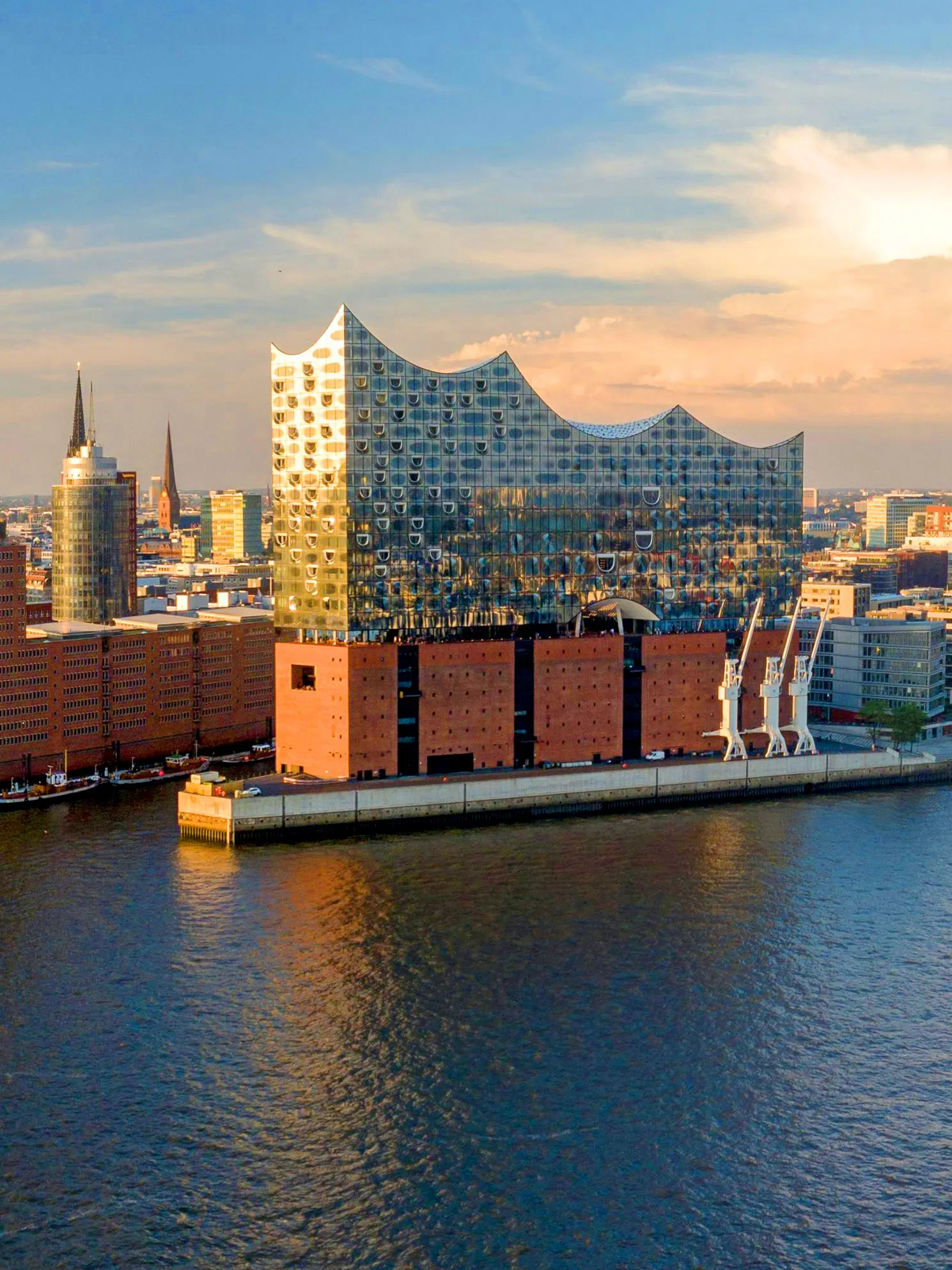 Panoramic view of the Elbphilharmonie concert hall in Hamburg, Germany, by the river.
