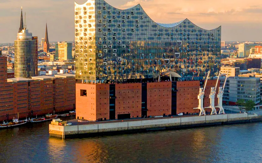 Panoramic view of the Elbphilharmonie concert hall in Hamburg, Germany, by the river.