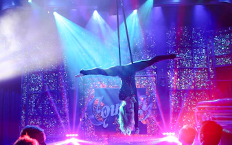 Performer in aerial act at Kick'n Topless Revue, Vegas stage show.