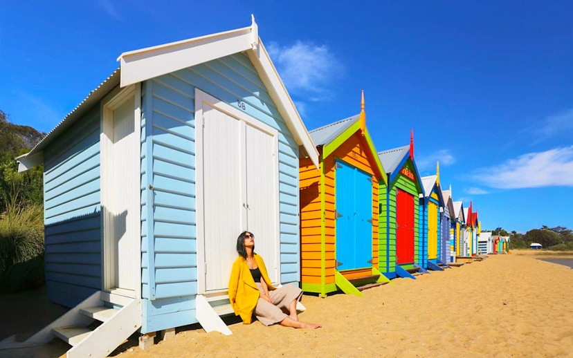 Colorful beach huts on Brighton Beach, part of the Phillip Island Tour.