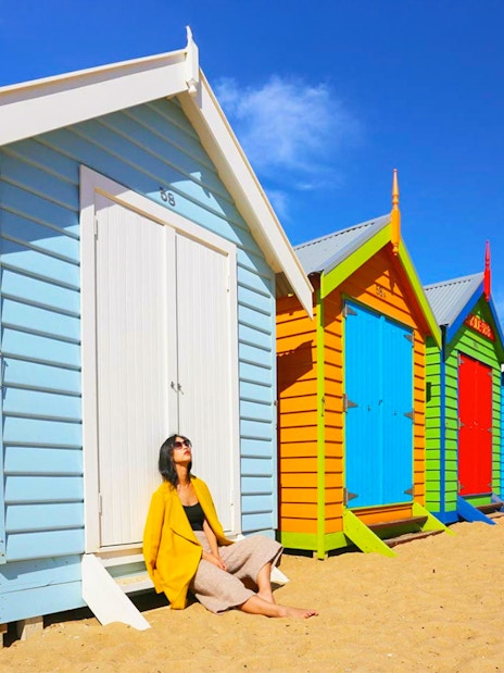 Colorful beach huts on Brighton Beach, part of the Phillip Island Tour.