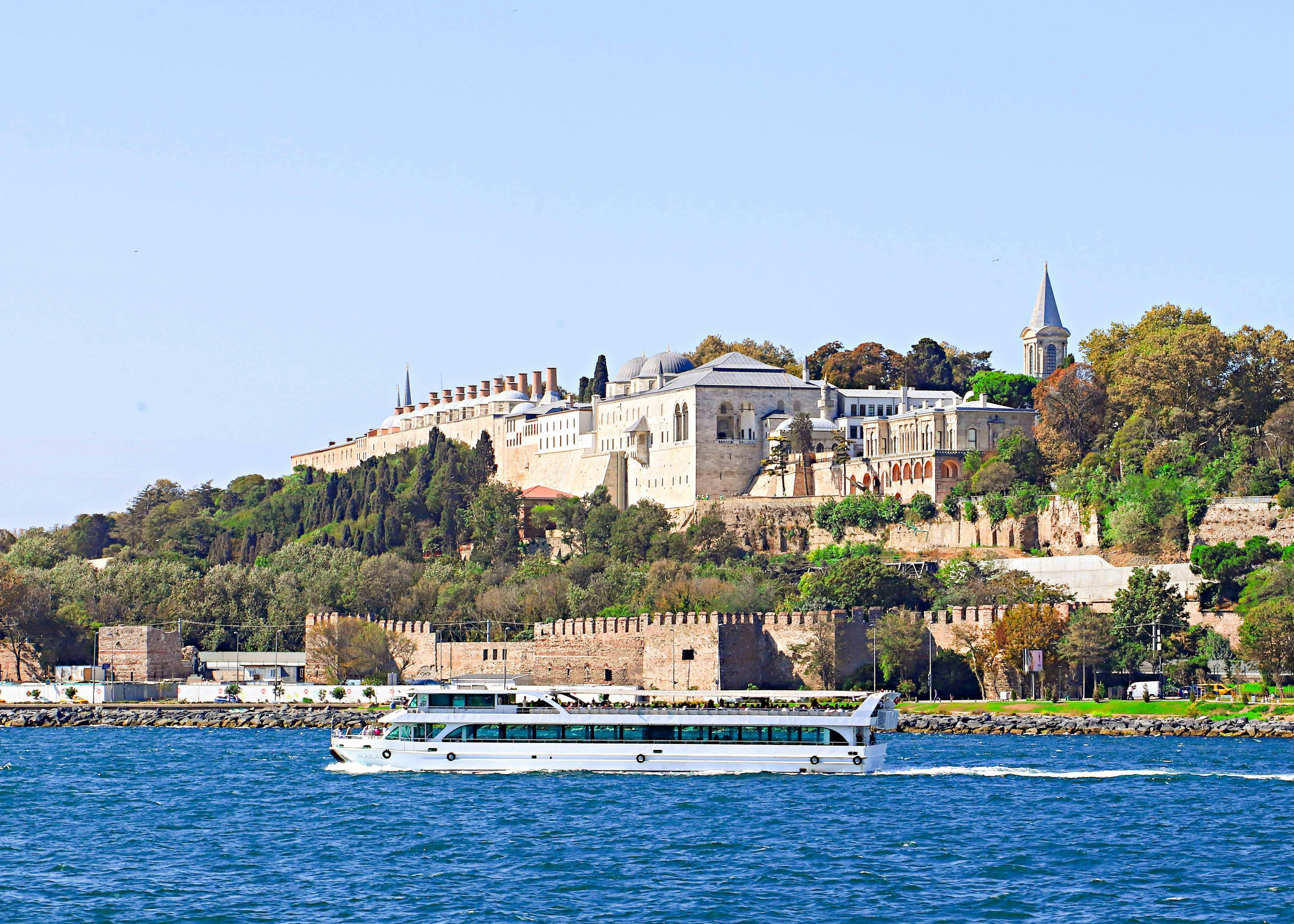 Bosphorus yacht cruising past Topkapi Palace in Istanbul.