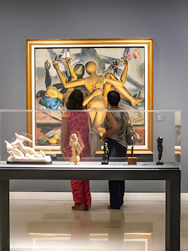Visitors viewing modern art at Carmen Thyssen Museum, Spain.