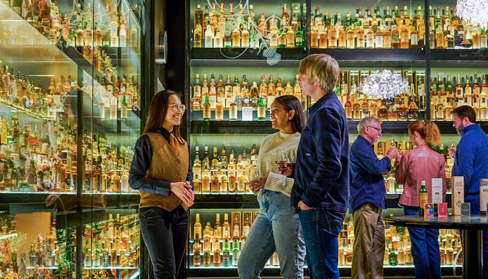 Scotch Whisky Experience tour guide explaining whisky aging process in Edinburgh.
