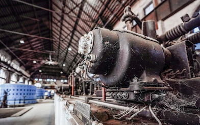 Niagara Power Station interior with vintage machinery and large blue generators.