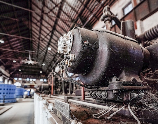 Niagara Power Station interior with historic machinery and tunnel access signs.