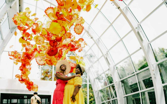 Visitors enjoying colorful glass sculptures at Chihuly Garden and Glass, Seattle.
