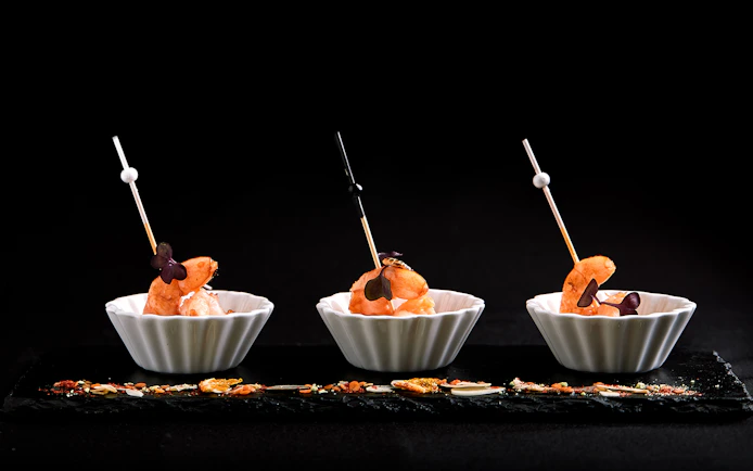 Tiger baby prawns in white bowls at Ginger Restaurant.