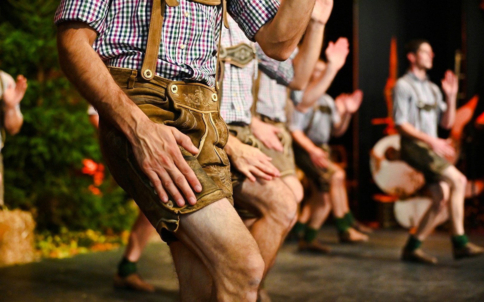 Men performing traditional Schuhplatteln dance in Salzburg, Austria.
